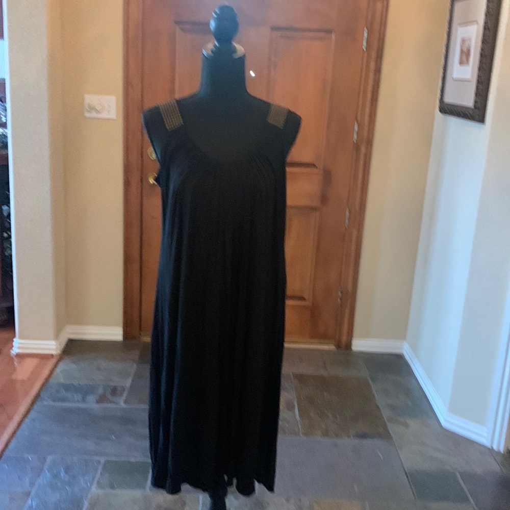 Casual black shift dress with unusual gold studding at shoulders. Has scoop neck
